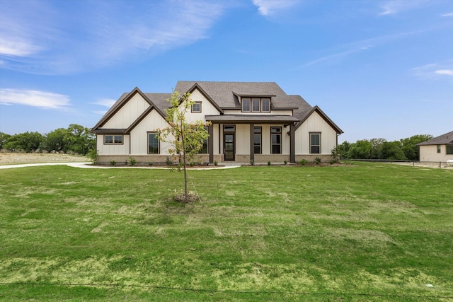 view of front of property featuring a front lawn and a porch