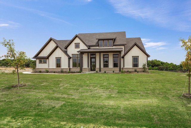 view of front of house with a porch and a front lawn