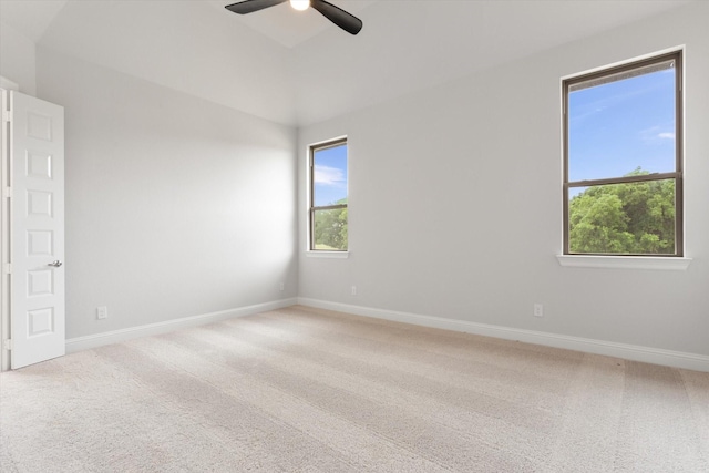 empty room featuring carpet flooring and ceiling fan