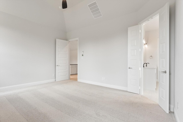 unfurnished bedroom with ceiling fan and light colored carpet