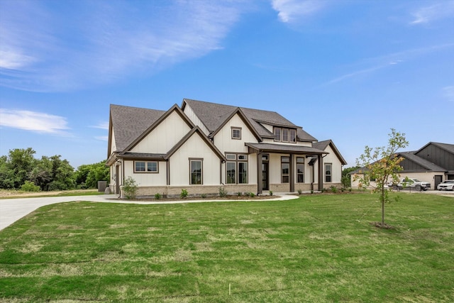 view of front of house with covered porch and a front lawn