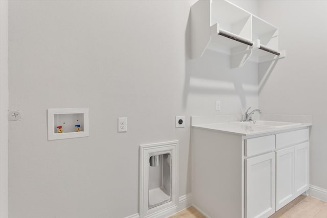 laundry room with sink, cabinets, light wood-type flooring, electric dryer hookup, and washer hookup