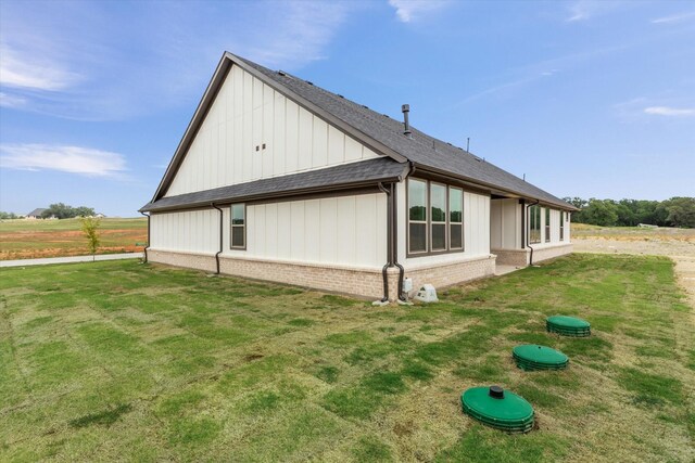 view of home's exterior featuring a lawn