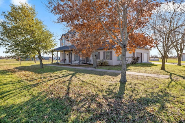 view of front of house with covered porch and a front lawn