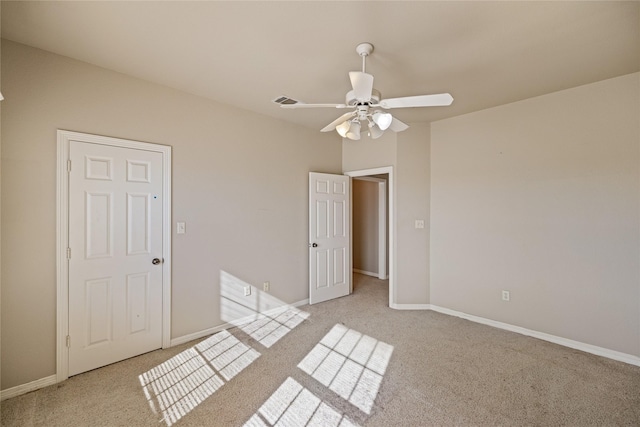 unfurnished bedroom with light carpet and ceiling fan