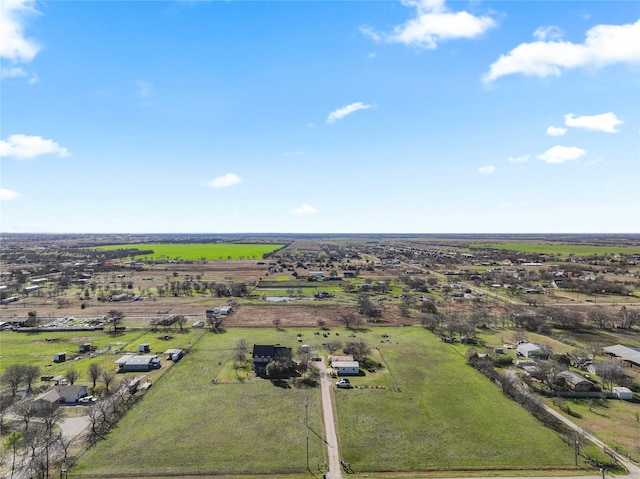 birds eye view of property with a rural view