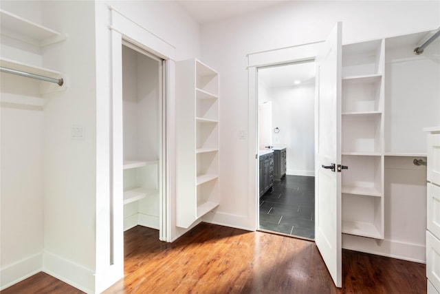 walk in closet featuring hardwood / wood-style flooring