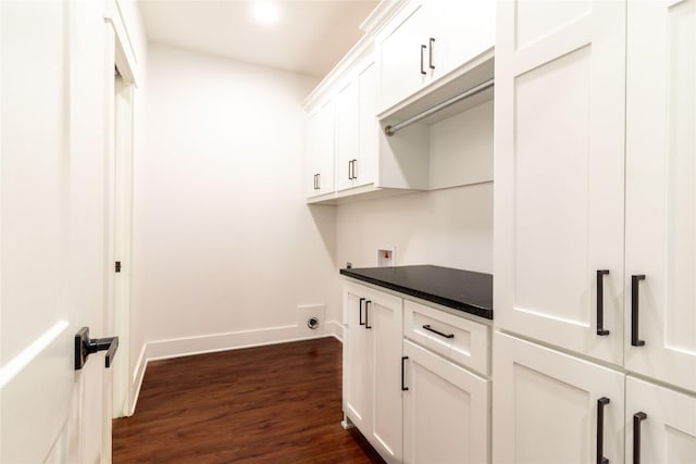 laundry room with cabinets, washer hookup, and dark hardwood / wood-style floors