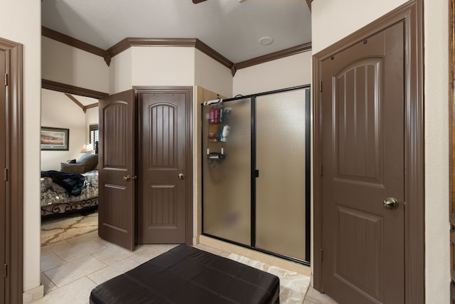 bathroom featuring tile patterned floors, an enclosed shower, and crown molding