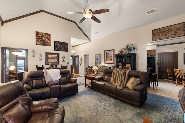 tiled living room featuring ceiling fan and high vaulted ceiling