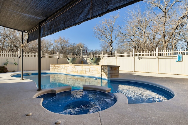 view of swimming pool featuring an in ground hot tub