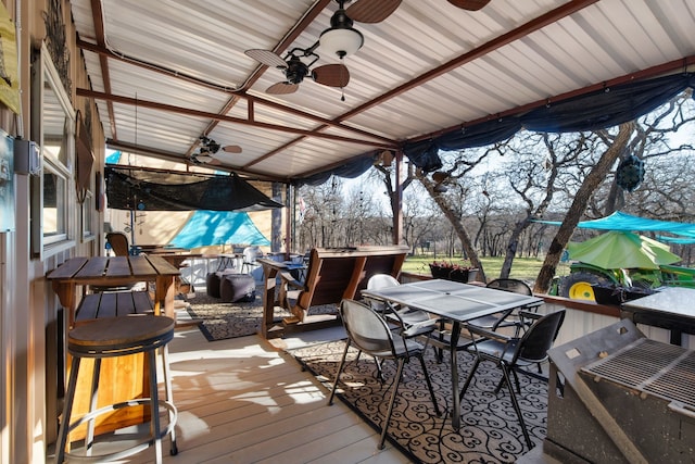 wooden deck with ceiling fan