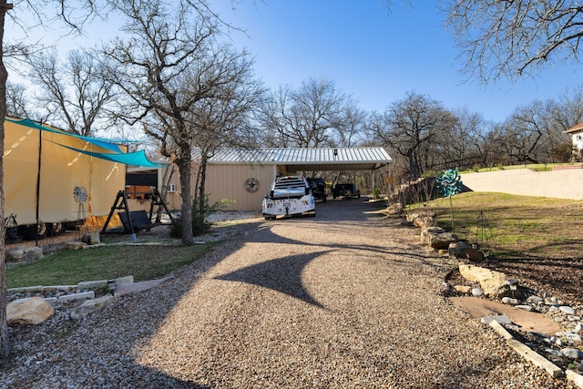 exterior space featuring a carport