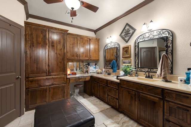 bathroom featuring ceiling fan, sink, tile patterned floors, and ornamental molding