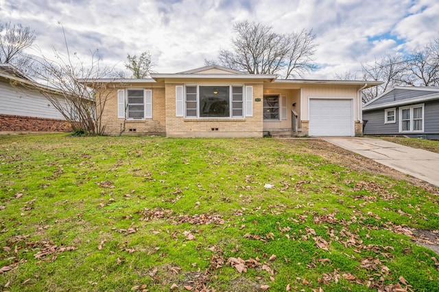 ranch-style home with a garage and a front yard