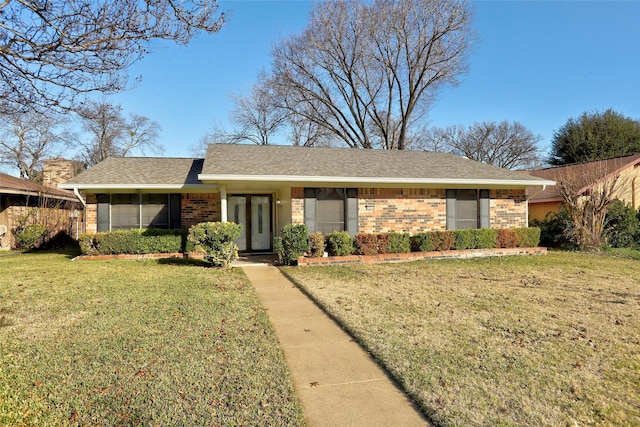 ranch-style home featuring a front yard