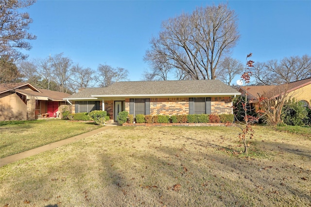 single story home featuring a front yard