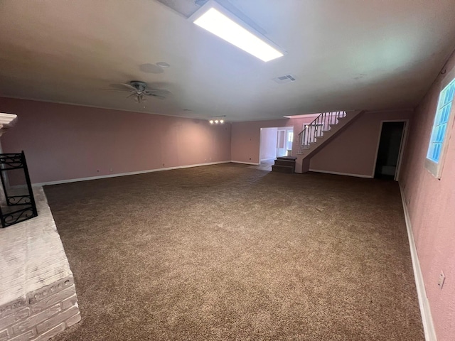 unfurnished living room with carpet floors and ceiling fan