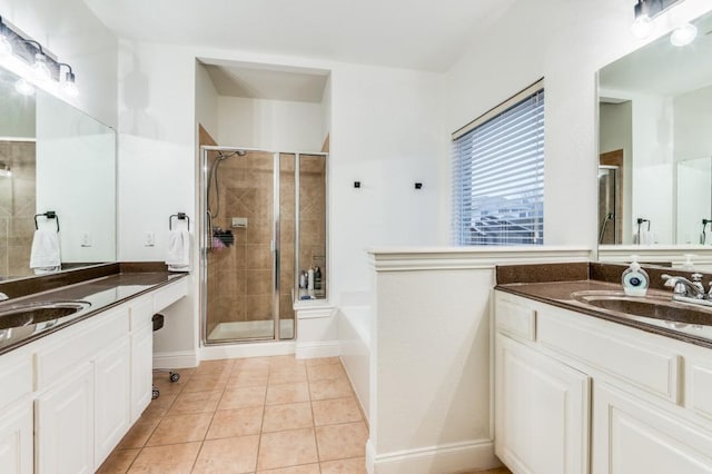 bathroom featuring tile patterned flooring, vanity, and independent shower and bath