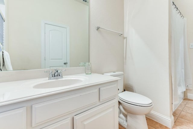 bathroom with a shower with curtain, tile patterned flooring, vanity, and toilet