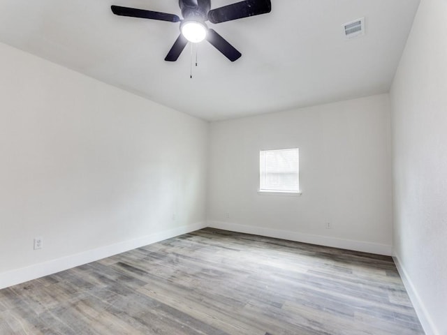 spare room featuring ceiling fan and light wood-type flooring