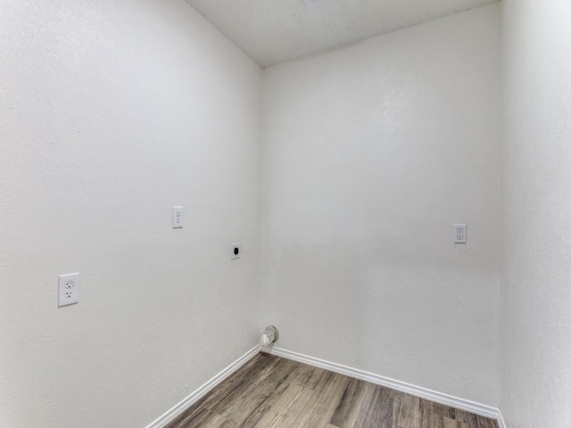 laundry room with wood-type flooring and electric dryer hookup