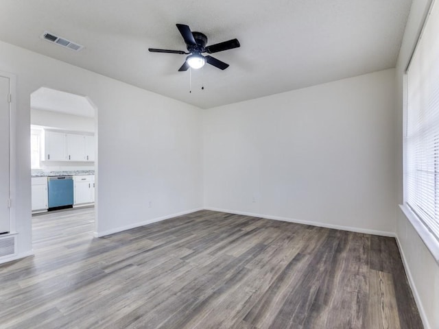 unfurnished room with ceiling fan and light wood-type flooring