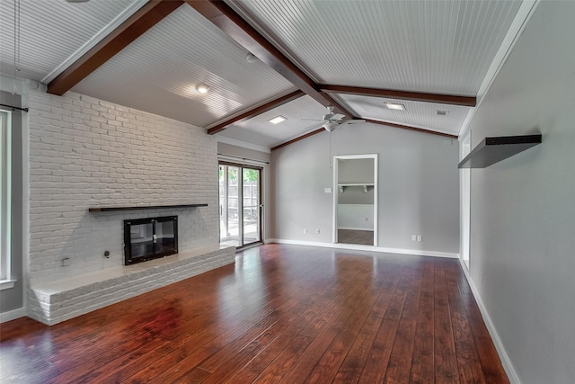 unfurnished living room with a brick fireplace, wood-type flooring, vaulted ceiling with beams, and ceiling fan