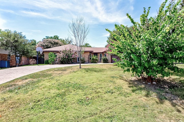 view of front of property with cooling unit and a front lawn