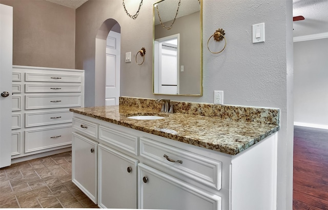 bathroom featuring vanity and ceiling fan