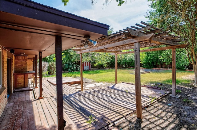 view of patio featuring a storage unit, a deck, and a pergola