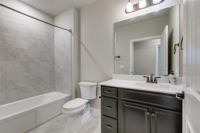 full bathroom featuring vanity, tiled shower / bath combo, and toilet