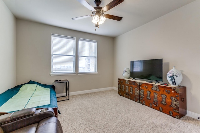 bedroom featuring light colored carpet and ceiling fan