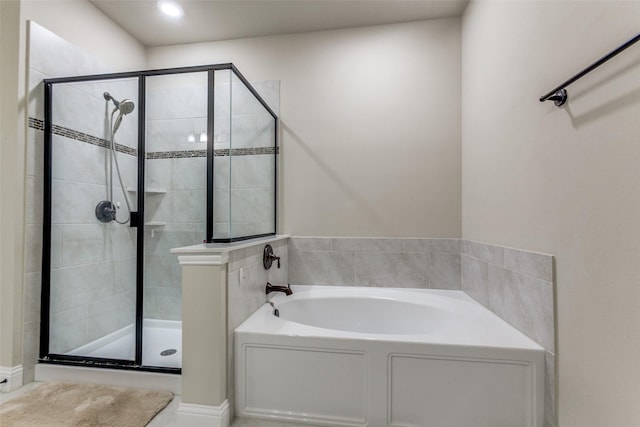 bathroom with separate shower and tub