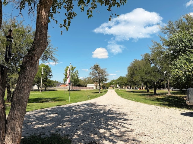 view of property's community featuring a lawn