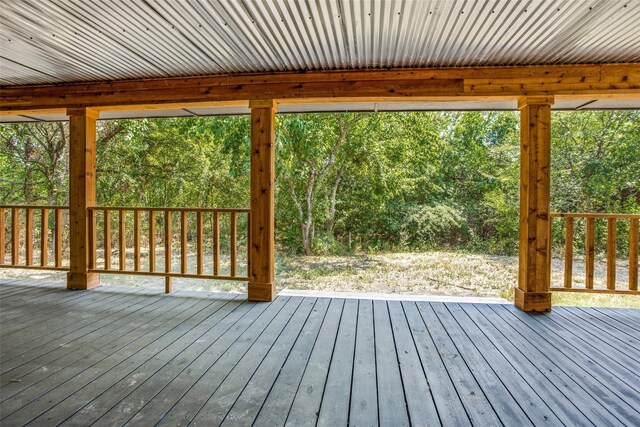 deck featuring a garage and an outdoor structure