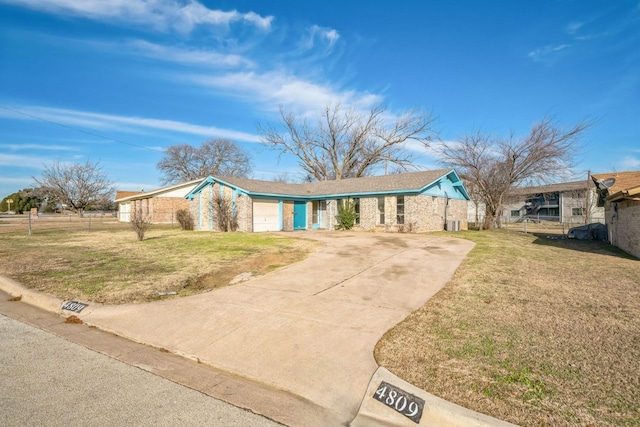 ranch-style house with a front yard and a garage