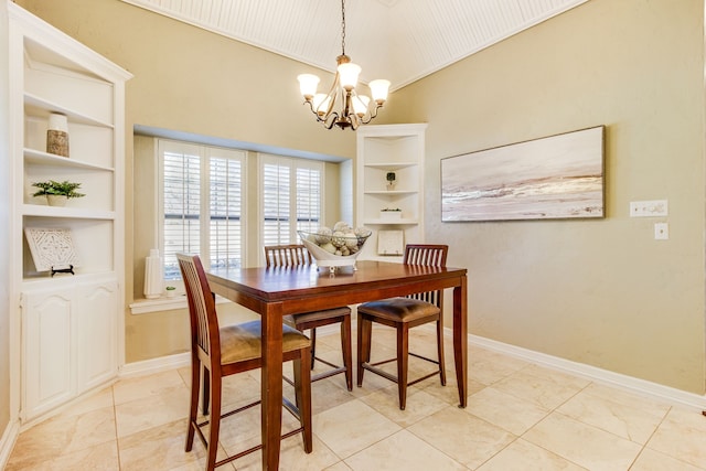 dining space with baseboards, built in shelves, and a chandelier