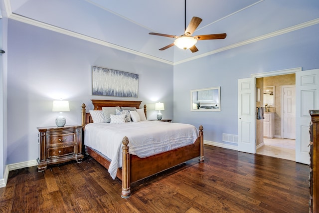 bedroom featuring baseboards, wood finished floors, visible vents, and ornamental molding