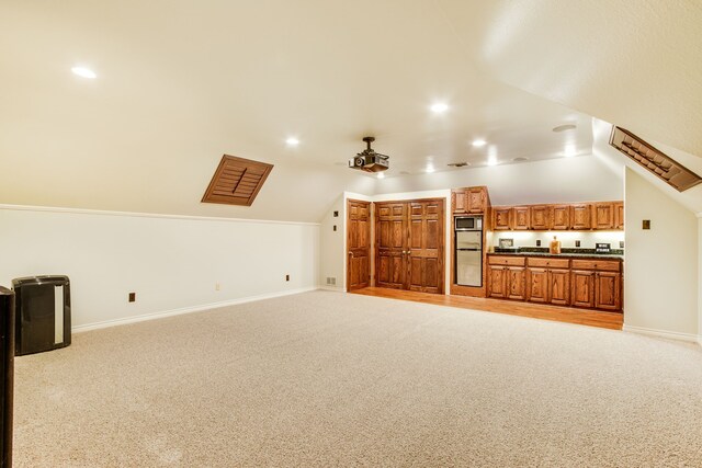 laundry room with washing machine and dryer, crown molding, and cabinets