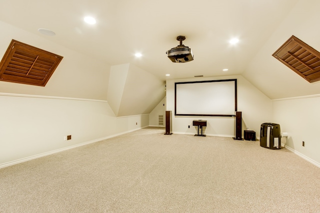 cinema room featuring recessed lighting, baseboards, lofted ceiling, and carpet floors