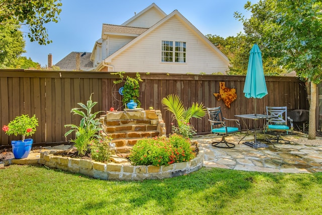 view of yard featuring a patio area and a fenced backyard