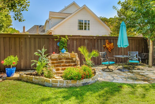 rear view of property with a patio area, a gazebo, an outdoor living space, and a lawn