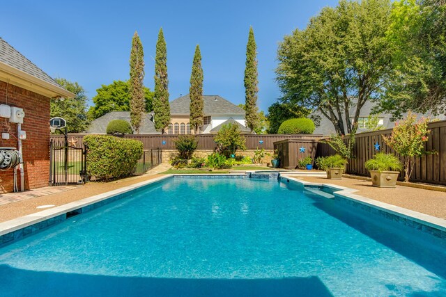 view of pool with a gazebo, a fenced backyard, a fenced in pool, and a patio