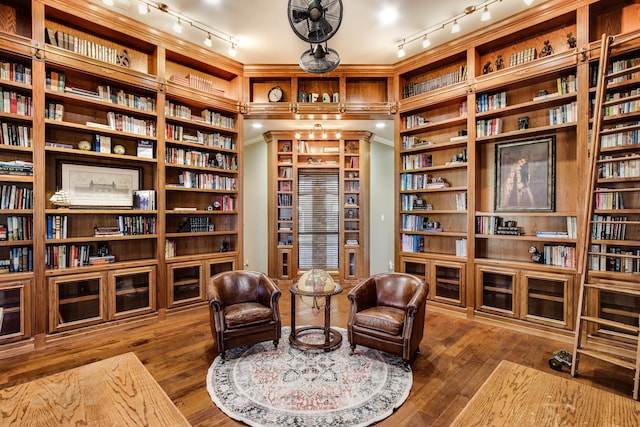 sitting room featuring dark hardwood / wood-style flooring and crown molding