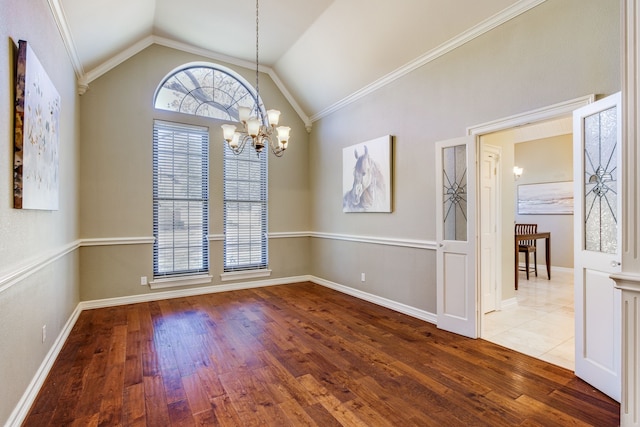 unfurnished dining area with hardwood / wood-style flooring, baseboards, lofted ceiling, and a chandelier