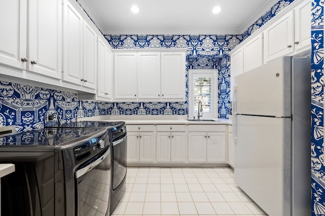 kitchen featuring stainless steel fridge, black range with electric cooktop, sink, electric range, and white cabinets