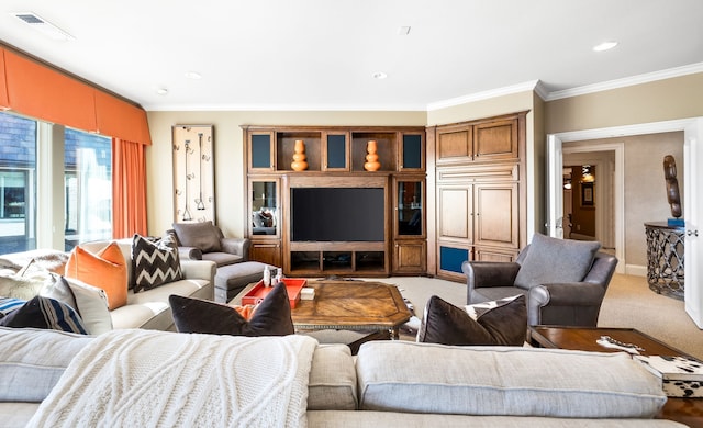 carpeted living room with ornamental molding