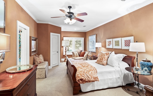 carpeted bedroom with crown molding and ceiling fan