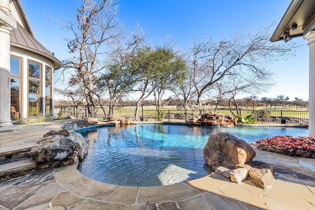 view of swimming pool featuring pool water feature